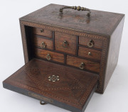 An Anglo-Indian spice box, padouk and sandalwood sumptuously inlaid with brass, bone, silver and ebony, interior fitted with seven staggered drawers, with original key, late 18th early 19th century, 13cm high, 19cm wide, 13cm deep - 4