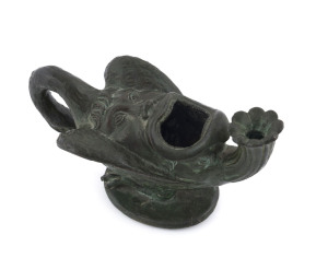 An antique oil lamp, cast bronze in the form of LEDA AND THE SWAN, 18th/19th century, 15.5cm across