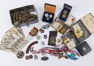 Coins - World: Miscellany: many of Dutch origin with 1791 silver 1g, 1929 & 1939 silver 1g, 1980 proof coin set, plus Netherland Indies 1908 2½c, New Guinea 1936 one penny (60+), Netherland Indies 1930s-40s 1c (c.200); late-1930s Bicycle Tax plates (24), military badges/collars (7), military themed postcards (7); also Australia 1920 Royal Visit medallion & 1951 50th Anniversary medallion; condition variable. Nice variety.