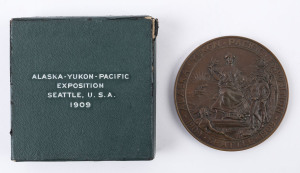 Collectables: Exhibitions: 1909 Alaska Yukon Pacific Exposition: Award Medal in bronze, 76 mm, 180gms. Inscribed SILVER MEDAL. The obverse shows a seated female figure with olive branch in one hand and a plaque of George Washington in the other. She is fl