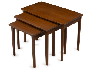 A nest of three teak coffee tables, circa 1960s, the largest 46cm high, 67cm wide, 39cm deep