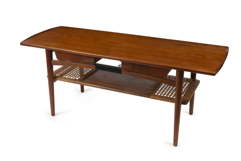 A vintage retro four drawer coffee table, teak with woven cane shelf, circa 1960, 55cm high, 134cm wide, 52cm deep