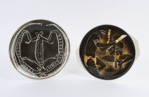 STUDIO ANNA: Two pottery plaques with Aboriginal motifs, factory mark and label verso, 31cm diameter and 32cm across