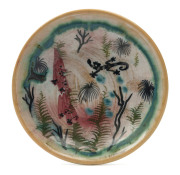 ARTHUR MERRIC BOYD pottery dish hand-painted with lizard, flowers and grass trees, incised "A.M.B.", 11.5cm diameter