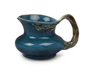 CRUFFEL Australian porcelain jug with windswept tree handle and decoration by Arthur Merric Boyd, original foil label to base "Art Cruffel Porcelain, Melbourne", 10cm high, 15cm wide