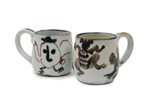 JOHN PERCEVAL: Two pottery teacups, incised "Perceval", 8cm high, 11cm wide