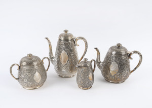 A four piece silver plated tea service with Persian style all over floral patterned repoussé decoration, circa 1885, the largest 23cm high