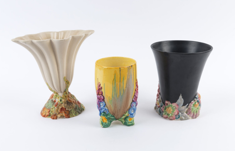 CLARICE CLIFF: Three floral porcelain mantel vases, two stamped "Bizarre By Clarice Cliff", the other "Clarice Cliff, Newport Pottery", ​the largest 20cm high