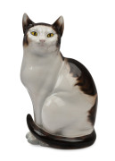 An Italian porcelain life size cat statue, mid 20th century, stamped "Made In Italy", circular factory mark illegible, 33.5cm high