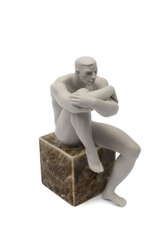 LLADRO Spanish porcelain statue of a seated male nude, circa 2004, stamped "Lladro Hand Made In Spain, Daisa, 2004", ​23cm high