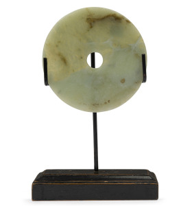 Archaic Chinese jade bi disc on later stand, 14.5cm diameter