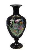 An English porcelain mantel vase with enamel floral decoration on black ground, circa 1860's, 30cm high