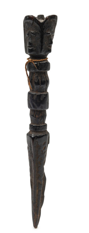 A Tibetan phurba, carved wood with three faces and remains of silk cord, 18th/19th century, 17.5cm long