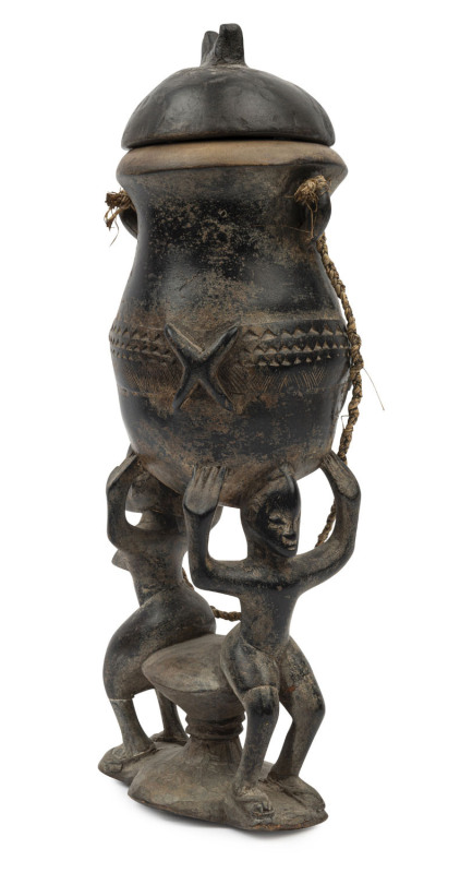 A Yoruba carved wooden funerary vessel, Nigeria, 19th/20th century, 37.5cm high