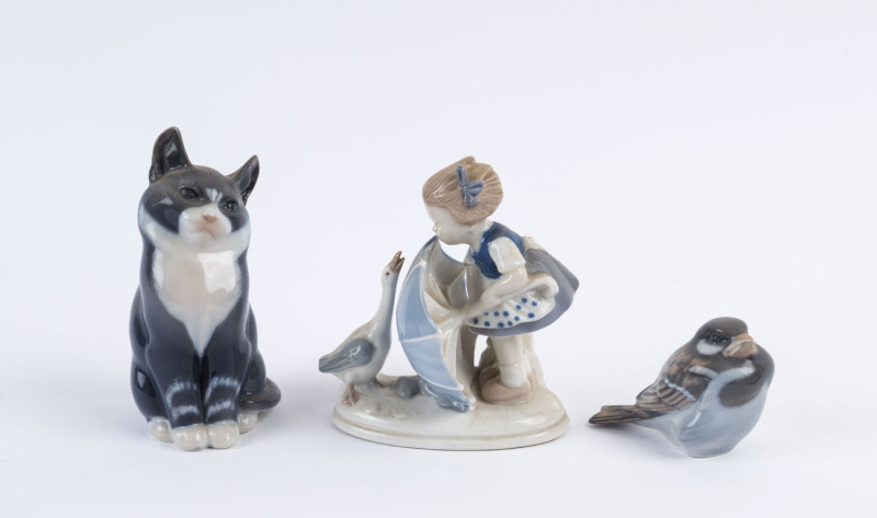 Three Continental porcelain statues, mid to late 20th century, cat and bird stamped "Royal Copenhagen", the cat 13.5cm high