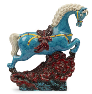 Italian vintage pottery horse statue glazed in blue, red and yellow, circa 1950's, signed "Made Italy", 26cm high, 23cm long