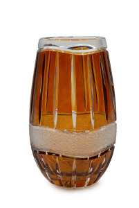 A Bohemian amber overlay cut crystal vase with wavy band of hand-cut decoration, early 20th century, 25cm high