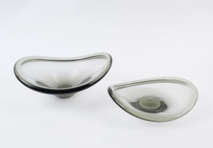 HOLMEGAARD: Two Danish grey glass fruit bowls, circa 1950's, engraved "Holmegaard", 26cm and 23cm wide