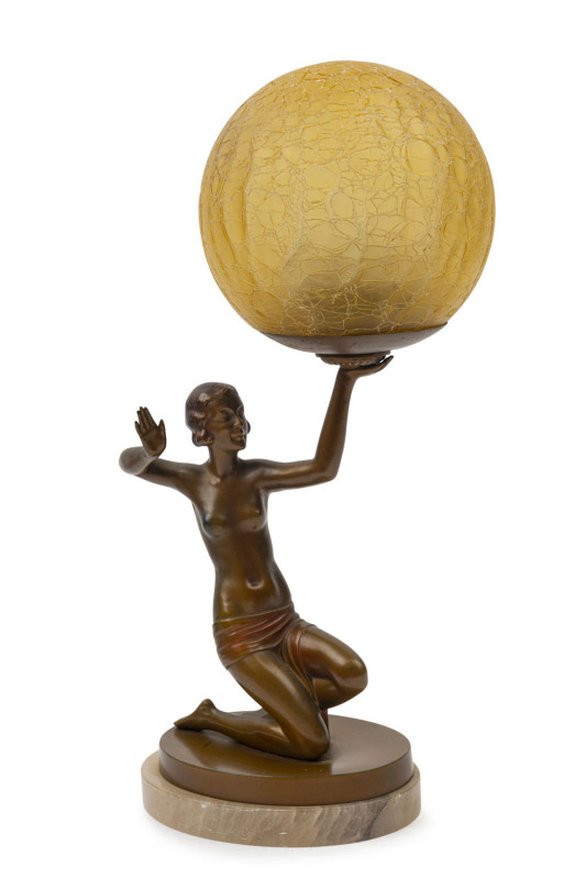 An Art Deco lamp with bronze female nude base on white onyx plinth with amber crackle glass spherical shade, circa 1930, ​39cm high