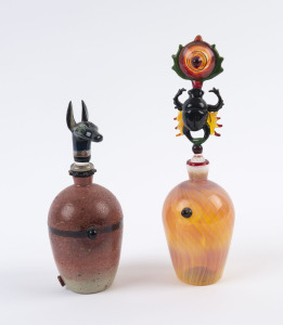 CHRISTIAN ARNOLD (attributed), two Egyptian themed perfume bottles with Anubis and scarab beetle stoppers, circa 2008, 21cm and 16cm high