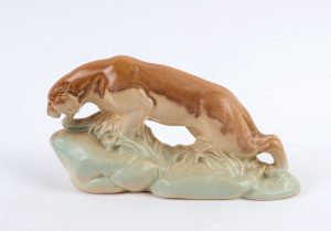 A porcelain Art Deco panther statue, most likely English circa 1930, 12cm high, 21cm long
