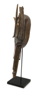 An African tribal mask, carved wood, copper and iron, ​69cm high