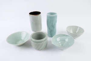 Six pieces of Australian studio pottery with celadon and sang de boeuf glazes, the largest 24cm high