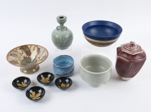 Red glazed lidded jar, green glazed vase, celadon fish bowl, and seven assorted pottery bowls, (10 items), the largest 22cm high