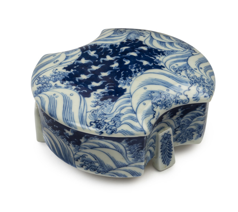 A Japanese Arita ware blue and white porcelain box with wave decoration, Meiji period, early 20thc century, ​10cm high, 19cm wide