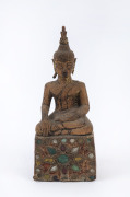 An antique Burmese Buddha statue, carved wood with remains of gilded finish, inlaid with glass, 18th/19th century, 21cm high