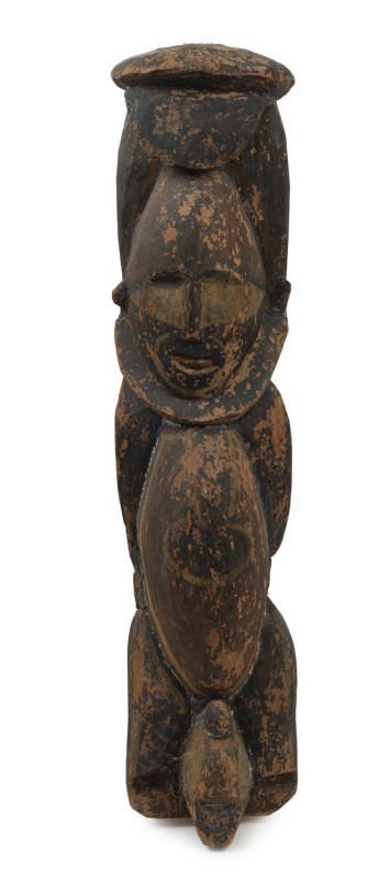 A tribal figural roof finial, carved wood and natural earth pigments, Papua New Guinea, ​66cm high