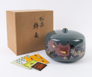 A fine Japanese ceramic vase with floral decoration on green ground, in original timber box, 16cm high, 23cm wide