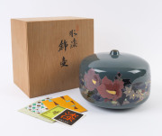A fine Japanese ceramic vase with floral decoration on green ground, in original timber box, ​16cm high, 23cm wide