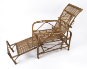 A cane adjustable armchair, circa 1920s, 65cm across the arms