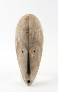 A mask, carved hardwood with limed finish, African origin, 44cm high