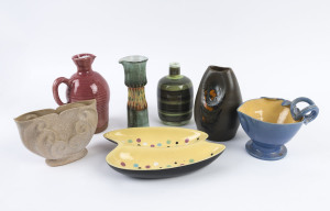 Seven pieces of Australian mid-century pottery including a DYSON blue glazed jug, two PHIL DUNN jugs, DORIAN SANDS green bottle vase, ELLIS pottery savory dish, JANET GRAY vase and a CHARLES WILTON pottery vase, ​the largest 21cm high