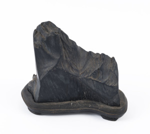 A Chinese scholar's stone on wooden base, 17cm high, 20cm wide