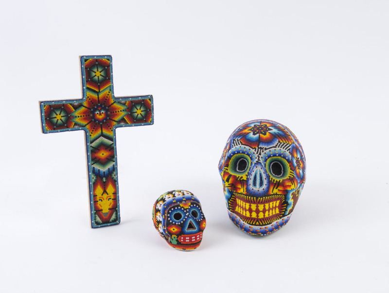 Mexican Huichol Skulls and crucifix adorned with fine beadwork, circa 2000, (3 items), ​the crucifix 26cm high