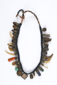 Tibetan charm necklace adorned with assorted shells, claws, stones and charms, 52cm long