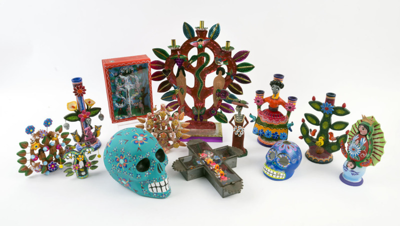 Thirteen assorted Mexican folk art religious statues, skulls and candelabra, hand-painted pottery, papier-mâché and tin, circa 2000, ​the largest 35cm high