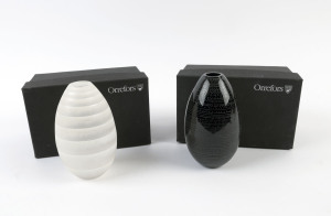 Two ORREFORS Swedish limited edition egg shaped vases by Ingegerd Råman, circa 2010, engraved "Orrefors, Liminted, 2010, Ingegerd Råman 300cl" with serial numbers, in original boxes, ​15cm high