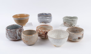 Eight Australian studio pottery tea bowls, the largest 9cm high, 13cm wide