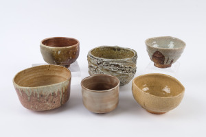 Six assorted Australian studio pottery bowls, ​the largest 13cm high, 17cm wide