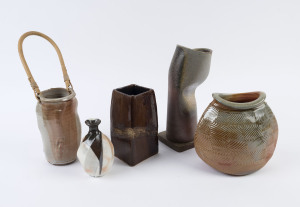 Five assorted studio pottery vases including one with cane handle, the largest 30cm high