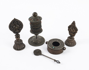 Five assorted Tibetan artefacts including a prayer wheel, silver and copper inlaid with coral and turquoise, 19th century, the largest 10cm high