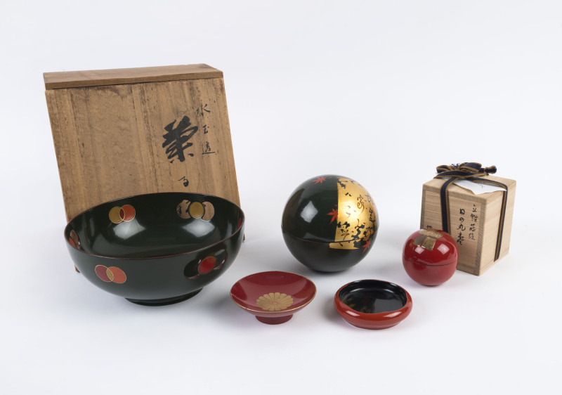 Japanese green lacquer ware bowl with coin motif in original spruce box, green spherical box, red spherical box with figural decoration in original box, small red and gold chrysathemum dish and small black and red dish, (5 items), coin bowl 8cm high, 19.5