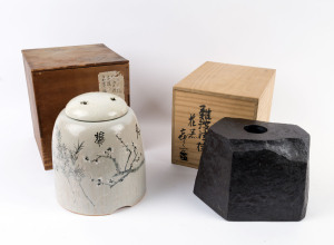 Japanese pottery vase in the form of a stone, and a lidded jar with blossom and calligraphy decoration, 18cm and 25cm high