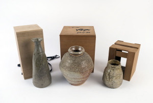Three Japanese earthen ware vases in original wooden boxes, the largest 29.5cm high