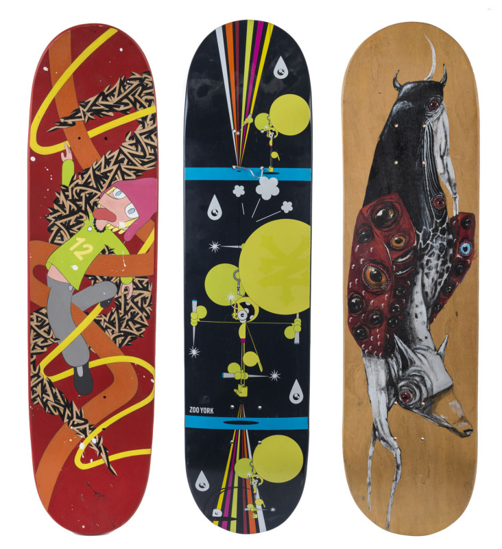 Seven assorted graffiti art skateboards, the largest 80cm