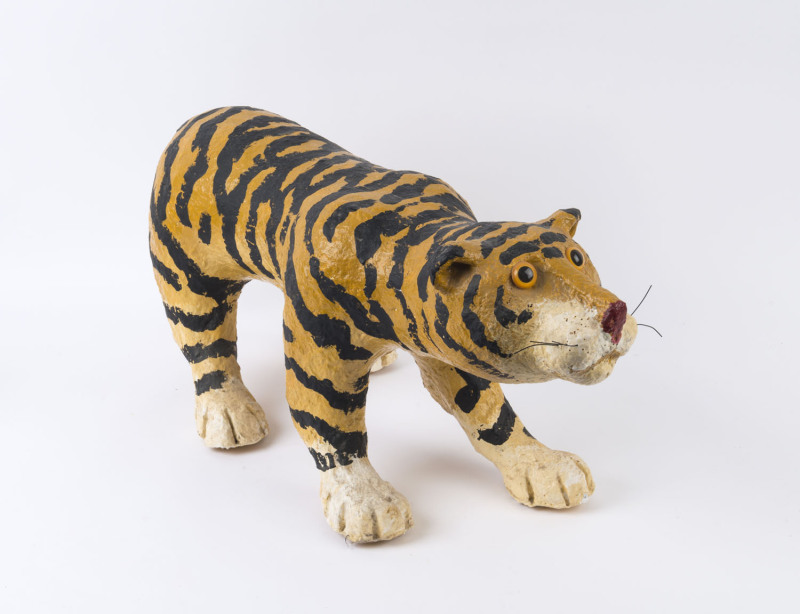 ARTIST UNKNOWN, tiger statue, papier-mâché, 35cm high, 85cm long